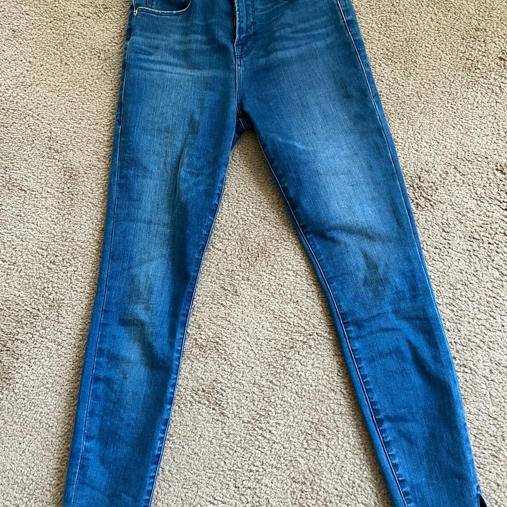 Good American step hem skinny jeans
